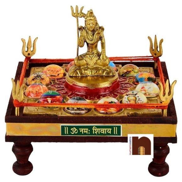 Very Beautifully Handcrafted In Brass Wood.Twelve (12 ) Jyitirlingas Along With Lord Shiva In Brass.For Worshiping Blessings Of Lord Shiva.Size-Width-6.5. 12 Jyotirling Sampoorna Shiv Yantra Chowki With Lord Shiva, 12 jyotirlinga Chowki, twelve jyotirlinga
